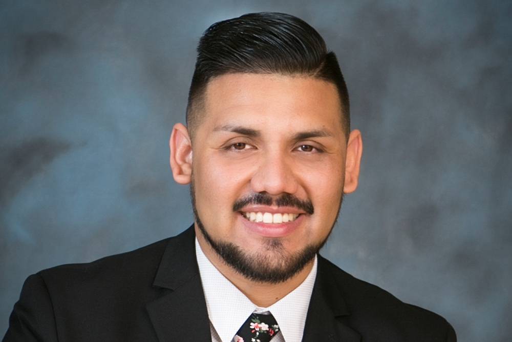 closeup portrait of a smiling young businessman